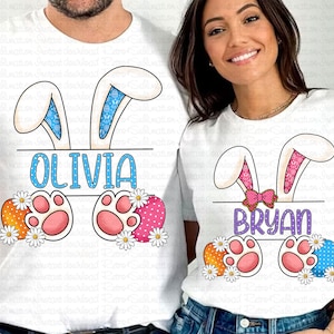 May include: Two white t-shirts with bunny ears and Easter egg designs. The first shirt says "Olivia" and the second shirt says "Bryan".