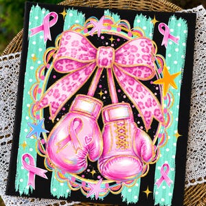 May include: A rectangular print featuring two pink boxing gloves tied together with a large pink leopard print bow. The design includes pink awareness ribbons, yellow stars, and a teal polka dot background framed by a decorative gold border.