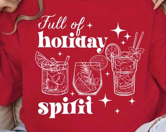 May include: Red sweatshirt with white text that says "Full of holiday spirit" and a graphic of three cocktails with citrus fruit and sprigs of mint.