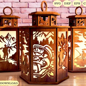 May include: Three wooden lantern designs with intricate cutouts. The lanterns feature a fishing theme with images of a fisherman, a bass fish, and a person in a boat. The lanterns are brown and have a rustic look.