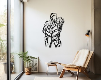 May include: A black metal wall art piece depicting two figures embracing, their forms intertwined with a tree-like design. The artwork is mounted on a white wall in a modern living space, with natural light from a large window.
