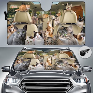 May include: A car sunshade with a colorful design featuring many cats in a car. The sunshade is made of a durable material and has a suction cup for easy attachment to the windshield.