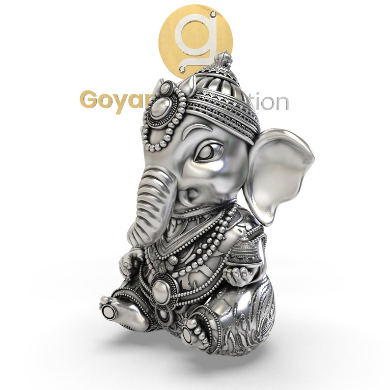 May include: A detailed silver figurine of the Hindu deity Ganesha, depicted in a seated position. The figure features intricate jewelry, a detailed headdress, and an elephant head. The image includes the text "Goyal Creation" and a gold logo.