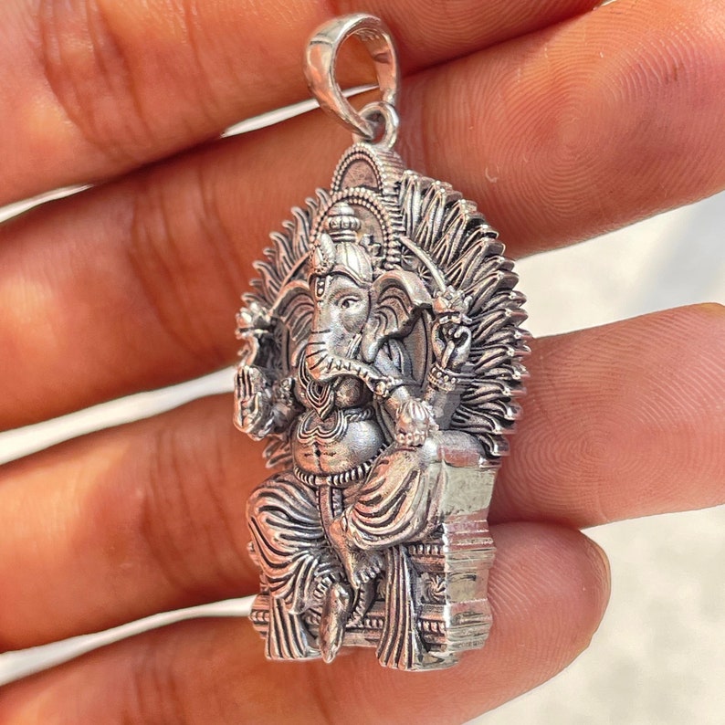 Lord Ganesha silver locket for devotees, crafted as oxidized temple jewelry for men and women
Sterling silver Ganeshji pendant suitable for housewarming gifts, religious occasions, festival wear, and devotion