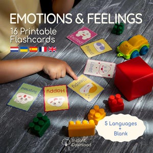 May include: A collection of emotion flashcards with illustrations and text, including "Happy," "Sleepy," and "Excited." The image also shows toy blocks, a red cube, and a yellow toy car. The text reads "EMOTIONS & FEELINGS" and "16 Printable Flashcards."