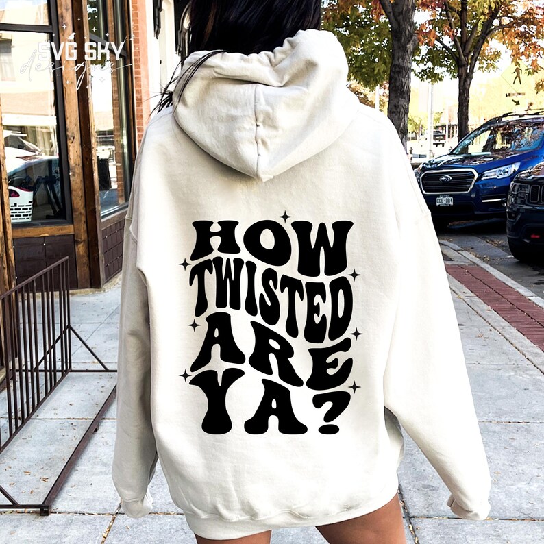 May include: A white hoodie with a black graphic that says "How Twisted Are Ya?" in a retro font.