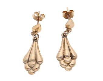 May include: A pair of gold drop earrings with a cluster of teardrop-shaped designs.
