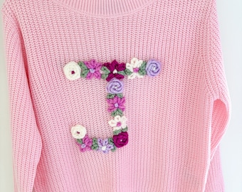 ADD flower letter design to your sweater