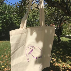 Stofftasche, GOTS Bio Baumwolle, lange Henkel, naturfarben, Stick pupipu Ele, lila