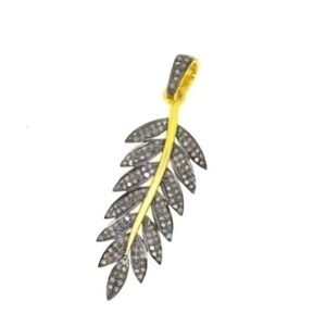 May include: A gold-toned pendant in the shape of a leaf, with a central stem and numerous leaf-shaped elements. The leaf elements are encrusted with small, dark-colored stones, creating a sparkling effect. The pendant hangs from a gold-colored loop.