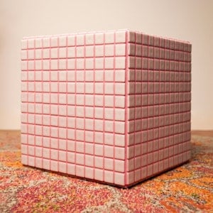 White and pink tiled cube