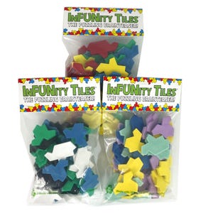 May include: Three bags of colorful plastic tiles labeled "Infunity Tiles The Puzzling Brainteaser!" The tiles are in various shapes and colors, including red, yellow, green, blue, white, purple, and light blue.