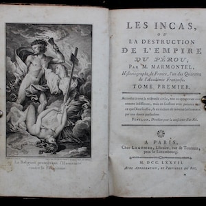 May include: An open antique book with a detailed black and white illustration on the left page and text on the right. The illustration depicts figures in a classical style. The text includes the title "LES INCAS" and the author's name.
