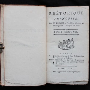 May include: A book titled "Rhetoric Francaise" by M. Crevier, Professor Emeritus of Rhetoric at the University of Paris. The book is volume two and was published in Paris in 1767.