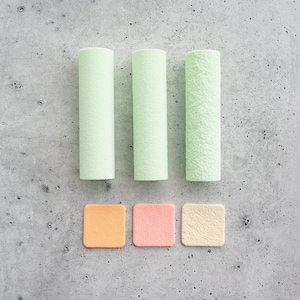 May include: Three cylindrical sponges in varying shades of light green, arranged in a row above three square sponges in shades of orange, pink, and beige. Each sponge features a textured surface, providing a variety of shapes and colors.