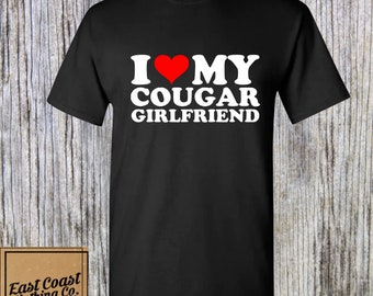 I Love My Cougar Girlfriend • Funny Adult Humor Shirt • Sarcastic Graphic Tee • Inappropriate Gift for Friends • Edgy Sarcasm Tee