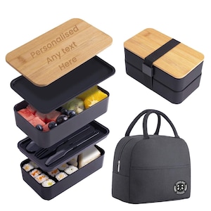 May include: A black and bamboo lunch box set with three tiers and a matching insulated lunch bag. The top tier has a personalised bamboo lid with the text "Personalised Any text Here".