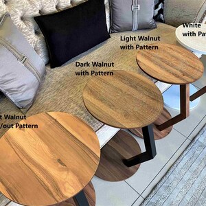 May include: Several small, round accent tables with wooden tops and different base designs. The tables are labelled "Light Walnut with/out Pattern", "Dark Walnut with Pattern", "Light Walnut with Pattern", and "White with Pattern".