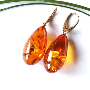 Orange oval amber earrings, drop shape amber earrings, amber gold plated, natural Baltic amber jewelry, golden color gemstone earrings gift