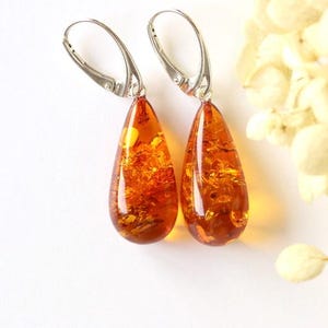 Golden amber earrings, cognac amber jewelry, dangle drop shape amber earrings, teardrop earrings, gold big Baltic amber, large gem earrings