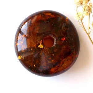 Dark cognac color amber donut amulet pendant, genuine orange color amber doughnut pendant, organic amber pendant with hole,large amber donut