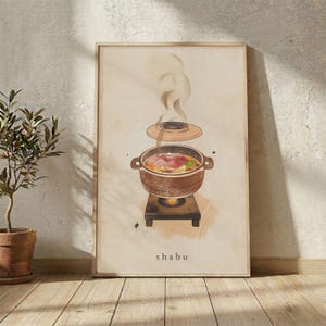 Puede incluir: Una lámina enmarcada con una ilustración en acuarela de una olla marrón sobre un hornillo portátil, con una tapa flotando encima. La olla contiene carne en rodajas y verduras en caldo. El texto "shabu" está impreso en la parte inferior.