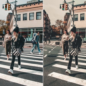 May include: Three people walking across a pedestrian crossing in a city street. The person in the centre is wearing a black leather jacket, a black and white striped skirt, and a black beanie. The person on the left is wearing a brown sweater and brown trousers. The person on the right is wearing a black leather jacket, a black and white striped skirt, and a black beanie.