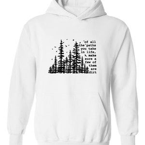 a white hoodie with trees and a quote on it