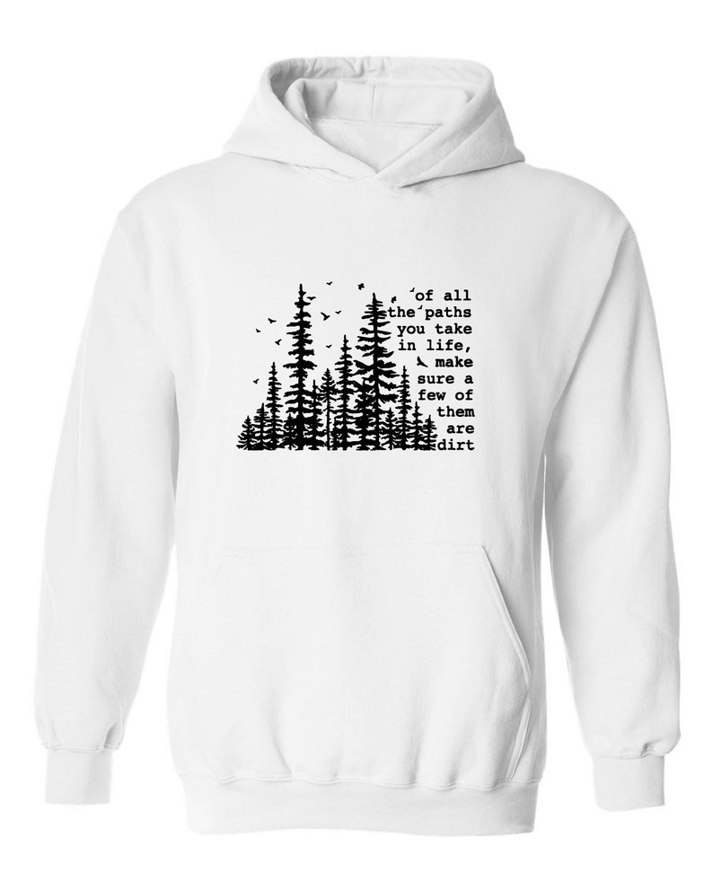 a white hoodie with trees and a quote on it