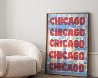 May include: A framed print with a blue and red design featuring the word "CHICAGO" repeated five times. The background is a blurry image of the Chicago skyline.
