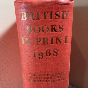 May include: A red hardcover book with gold lettering that reads "British Books In Print 1968" and "The Reference Catalogue of Current Literature".