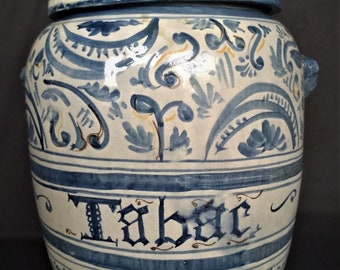 Heavy earthenware tobacco jar, decorated with blue ocher decorations and ornaments. Marked on the bottom with a sign unknown to me