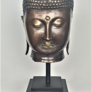 Bronze brass Thai Buddha head mounted on a metal pedestal, Dark brown patina