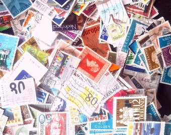May include: A collection of colorful postage stamps, featuring various designs and denominations. The stamps are from different countries, with text and images. Some stamps have the text "Nederland" and "Europa".