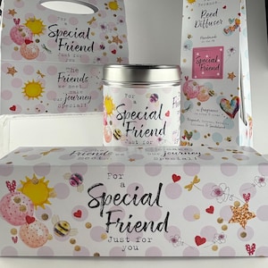May include: A gift set with a decorative theme, featuring a candle, a reed diffuser, and gift boxes. The items are decorated with pink polka dots, suns, bees, hearts, and the text "For a Special Friend".