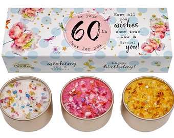 May include: A set of three candles in gold tins with colorful glitter and confetti. The candles are packaged in a box with a blue and white polka dot pattern and the text "On your 60th Just for you" and "Hope all your wishes come true... for a special you! ...happy birthday!"