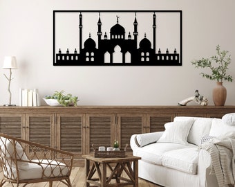 May include: Black metal wall art depicting a mosque with intricate details. The mosque is silhouetted against a white background. The art is framed with a thin black frame.