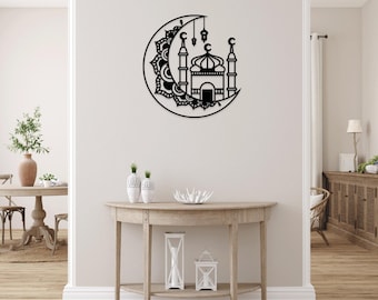 May include: Black metal wall decor featuring a crescent moon with a mandala design and a mosque silhouette. The mosque has a dome and two minarets.
