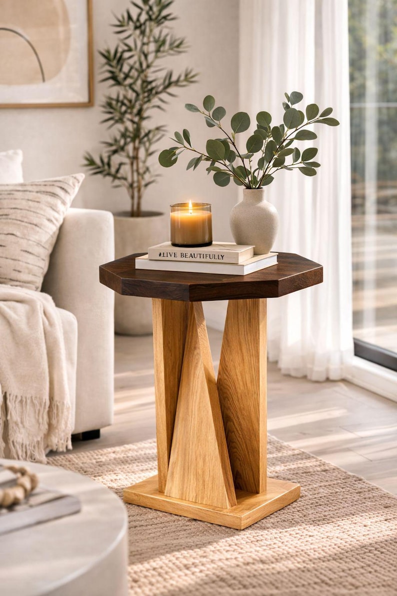 Golden oak small wooden side table in bright living room, used as wood plant stand with candle and leafy plant.