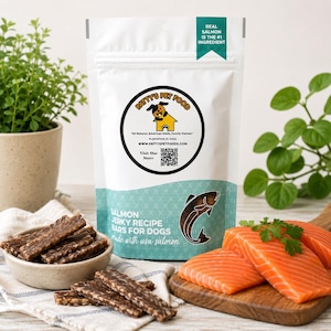 May include: A white stand-up pouch of Patty's Pet Food salmon jerky recipe bars for dogs. The label features a dog logo, a QR code, and the text Real Salmon Is The #1 Ingredient. Beside the pouch are salmon jerky treats in a bowl and raw salmon fillets.