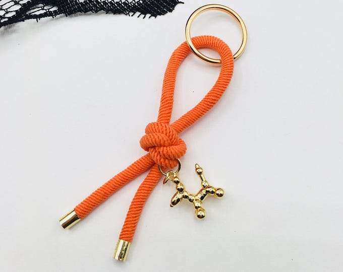 Paw Print Charm Knot Keychain – Stylish Accessory for Pet Lovers