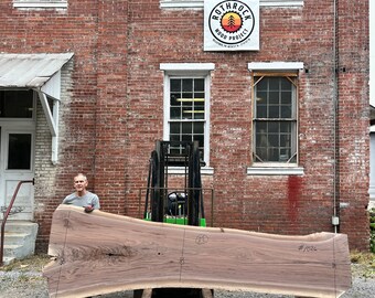 Live Edge Black Walnut Slab: Kiln dried, flattened, and sanded 150” x 46” x 2.5”