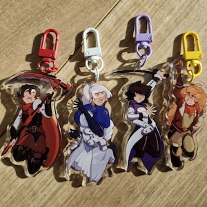 May include: Four acrylic character keychains with colorful metal clasps. The keychains feature illustrations of animated characters in various poses. The clasps are red, white, purple, and yellow. The characters are in various outfits.