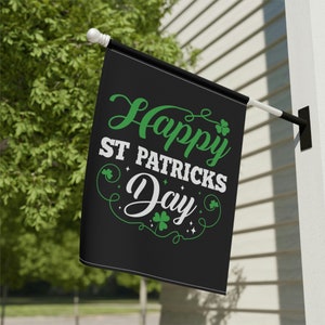 May include: Black and green Happy St. Patricks Day flag with shamrock designs.