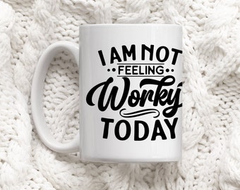 May include: White ceramic mug with a black design that says "I am not feeling worky today".