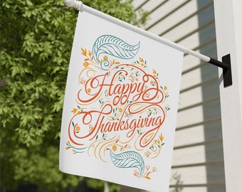 May include: A white Thanksgiving flag with the words "Happy Thanksgiving" in orange script. The flag features decorative floral and leaf accents in orange, teal, and yellow. The flag is mounted on a black pole holder.