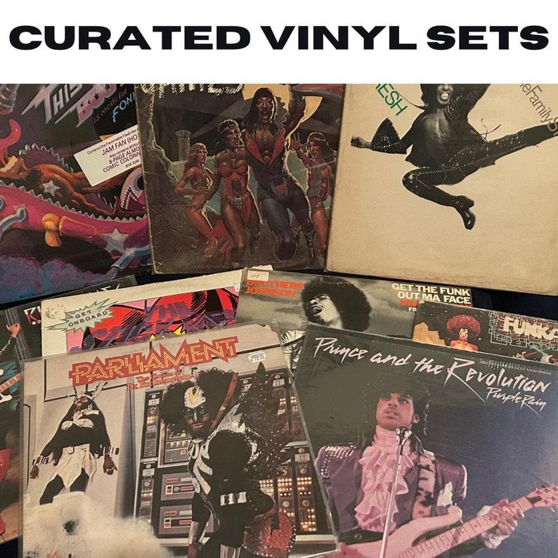 May include: A collection of vintage vinyl records featuring artists such as Parliament, Prince, and The Brothers Johnson. The records are displayed on a table with the covers facing up. The covers are colorful and feature various images and text.