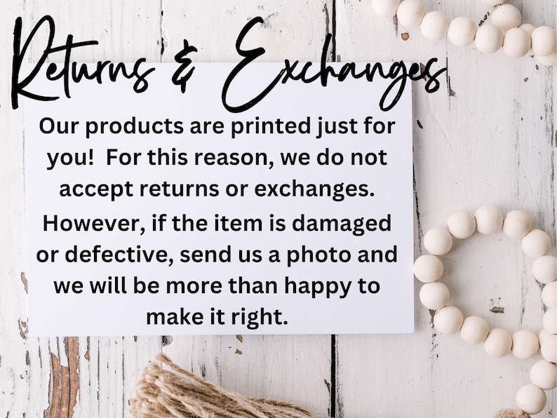 May include: White card with black text on a white wood background. The text reads "Returns & Exchanges" and explains the shop's return policy. The shop does not accept returns or exchanges, but will replace damaged or defective items.