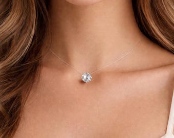 Colar delicado com um único cristal, imitação de diamante com efeito invisível de ilusão flutuante em cordão transparente.