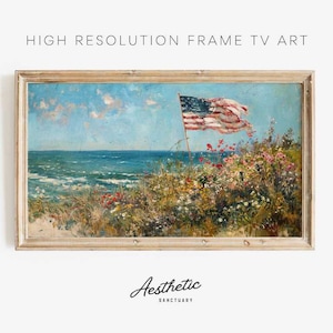 May include: A framed painting of a seascape with a waving American flag in the foreground. The flag is red, white, and blue and is flying in the wind. The sea is blue and the sky is light blue with white clouds. The painting is in a light wood frame.